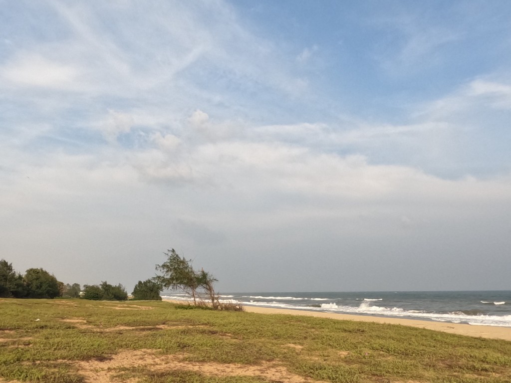 Pristine private beach along the East Coast Road — calm waves and open shoreline at La Vista Ocean